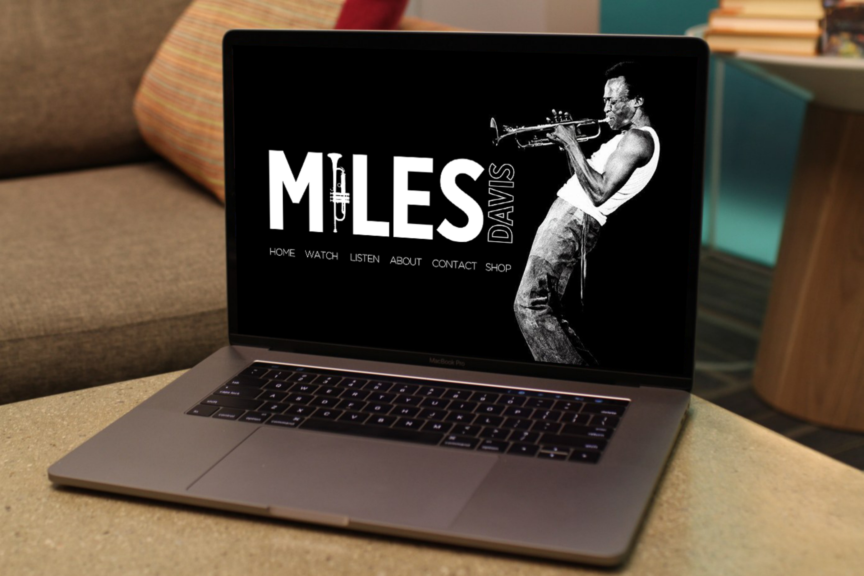 Miles Davis concept website displayed on a MacBook Pro
